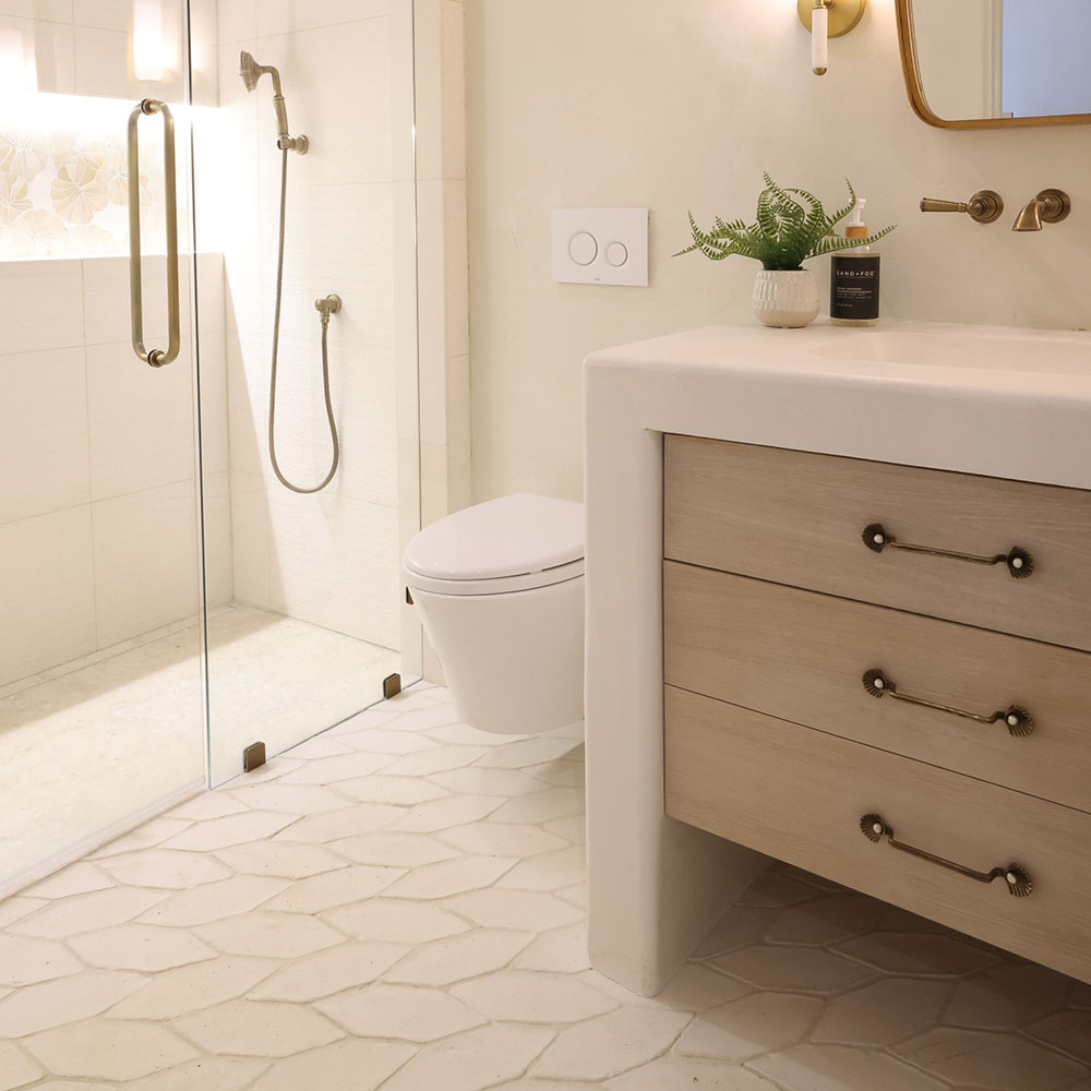 White terracotta tile installed on bathroom floor.